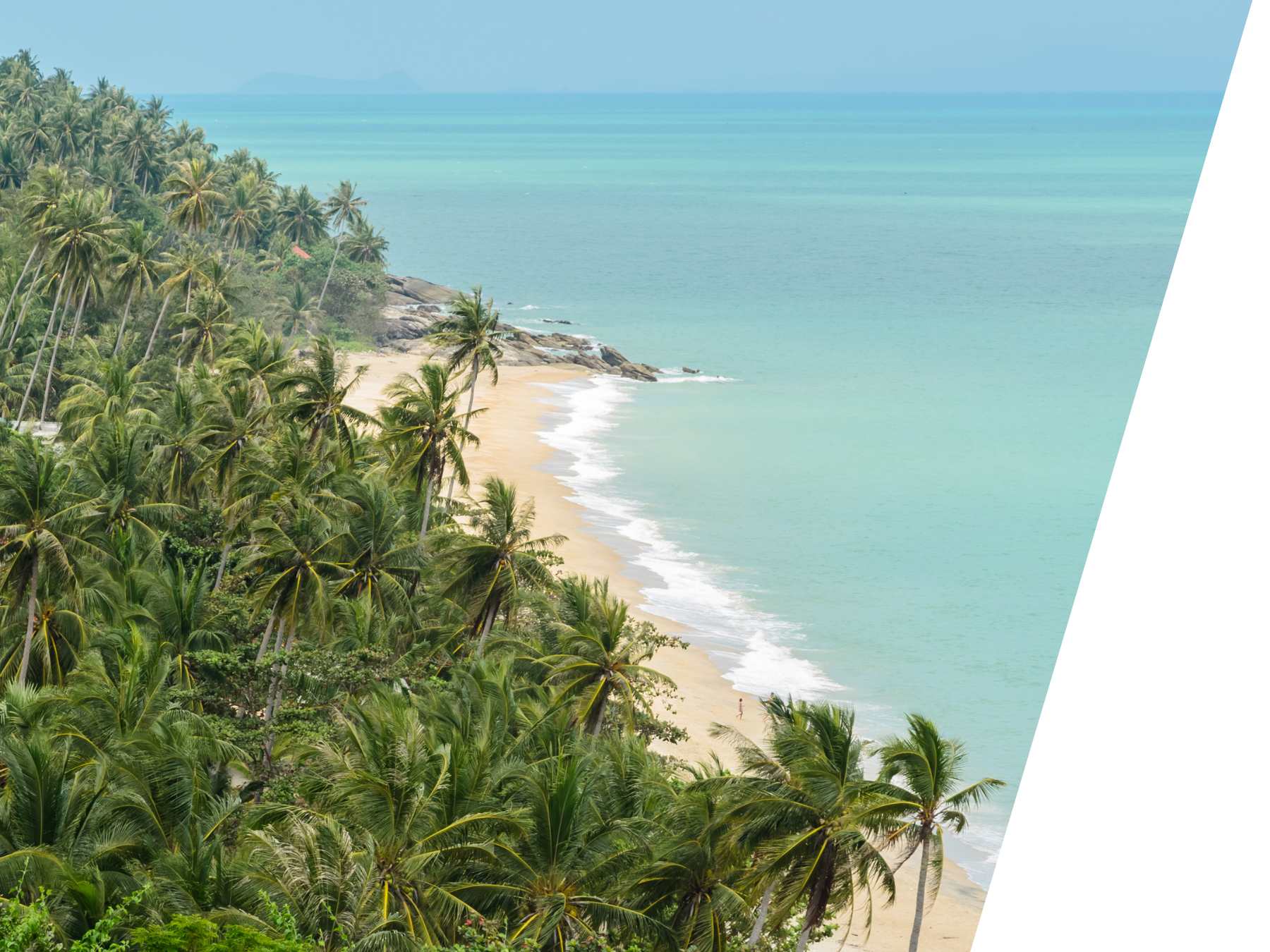 Stunning beach with palm trees and blue water - perfect place to visit for exchange students who study in Thailand.