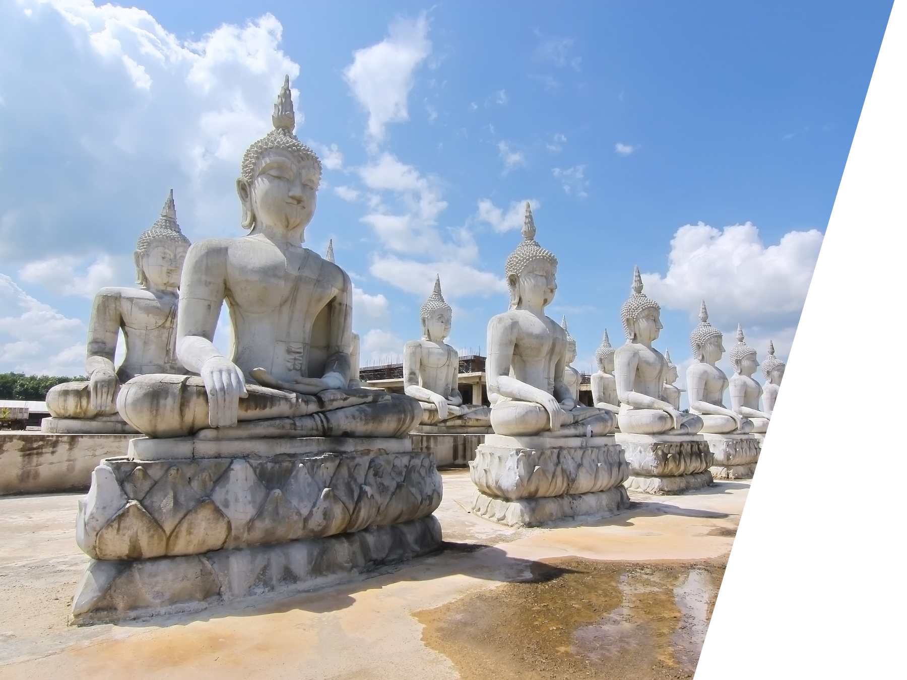 Statues in front of blue sky - perfect place to visit for exchange students who study in Thailand.